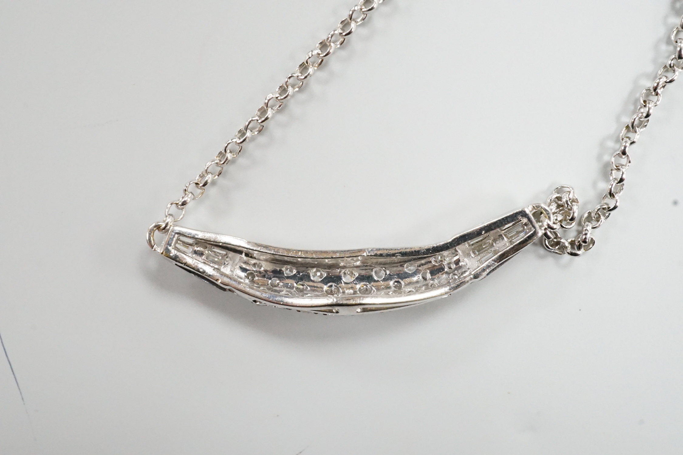 A modern Italian 750 white metal, trapeze and round cut diamond set cluster pendant necklace, 44cm, gross weight 8.8 grams.